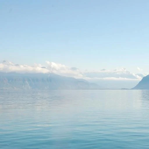 Calm lake after TurboClear removes a sailboat and its reflection