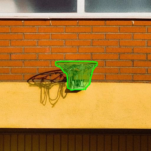 Basketball hoop selected with a green mask on a brick and stucco wall